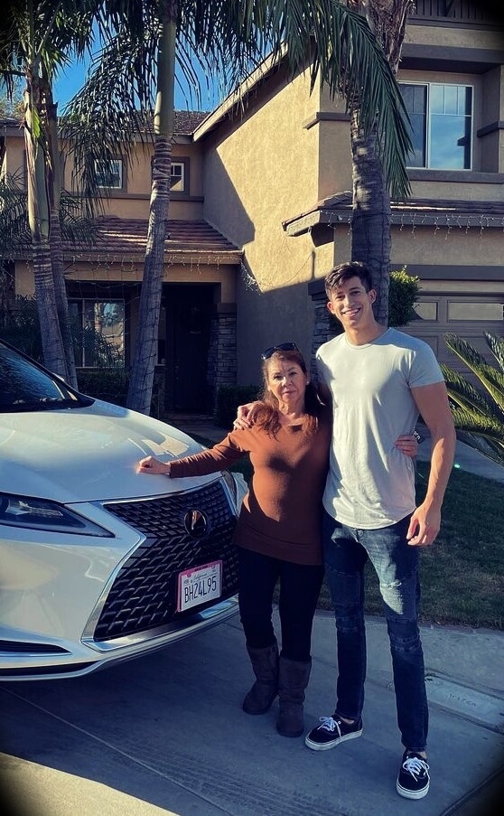Ricky Gutierrez with his mother, gifting her a car